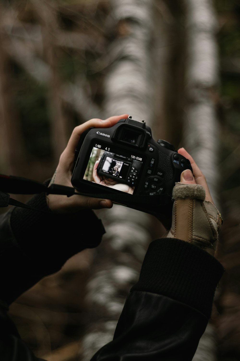 a person holding a camera up to take a picture