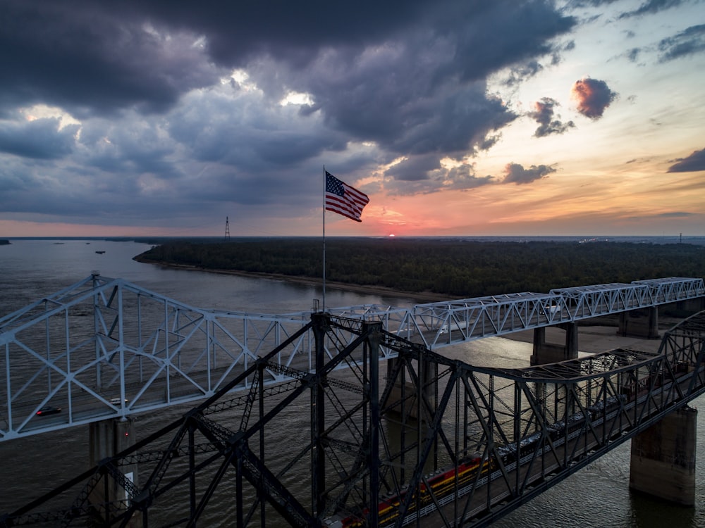 a bridge that has a flag on top of it