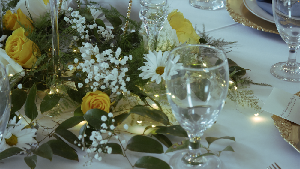 a close up of a table with flowers on it