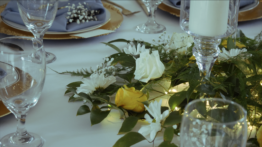 a close up of a table with flowers on it