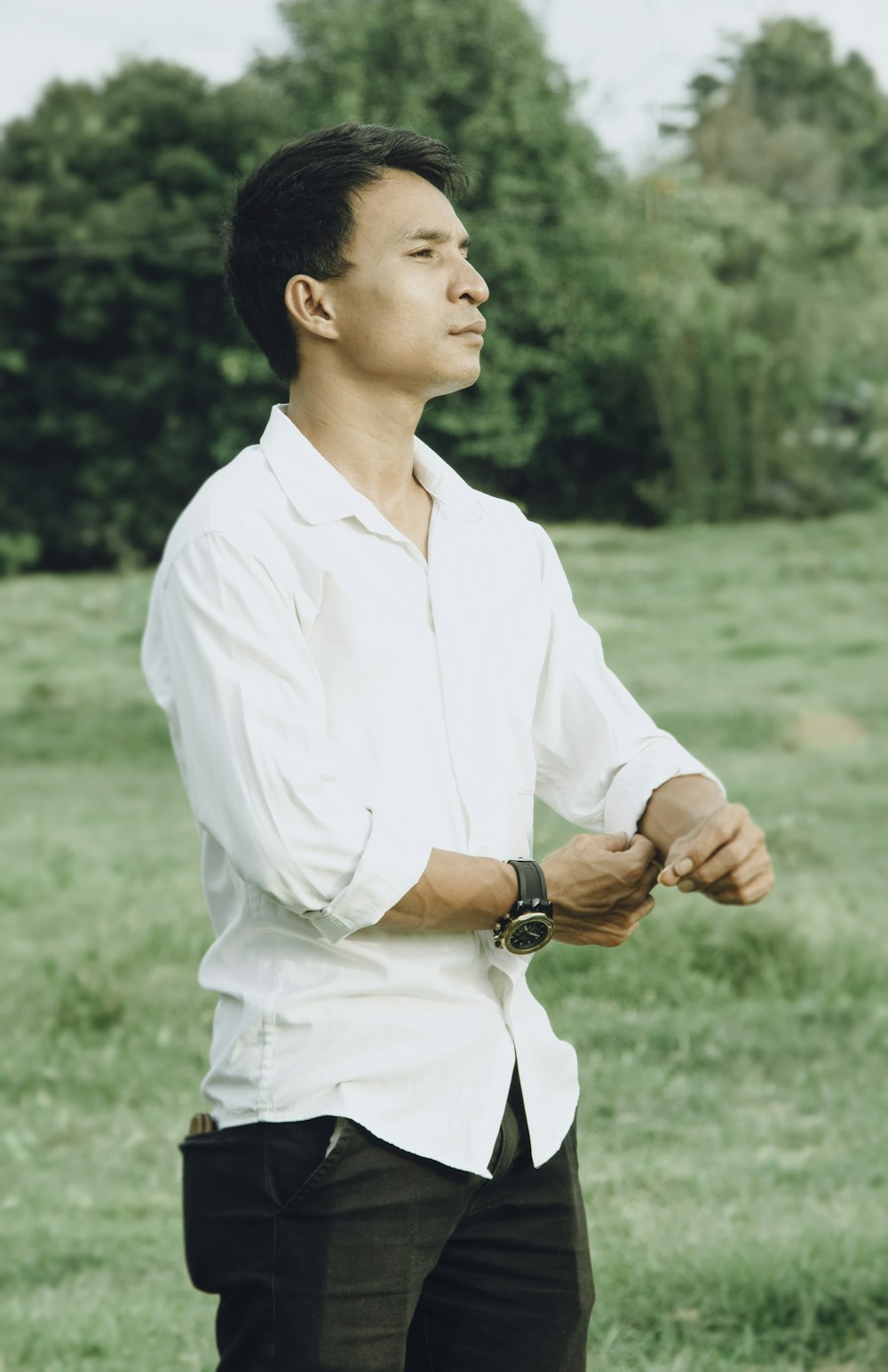 a man in a white shirt and black pants