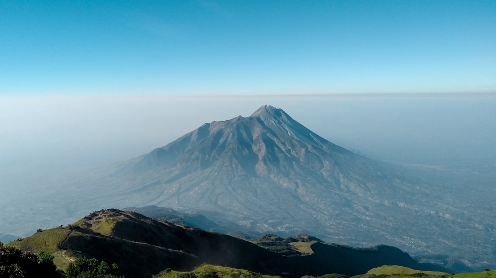 a view of a very tall mountain in the sky