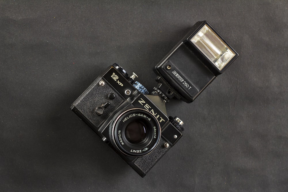 an old camera sitting on top of a table