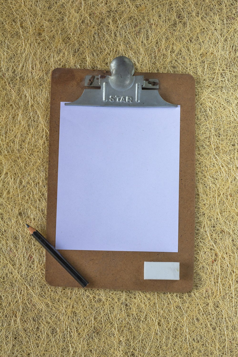a clipboard with a notepad attached to it
