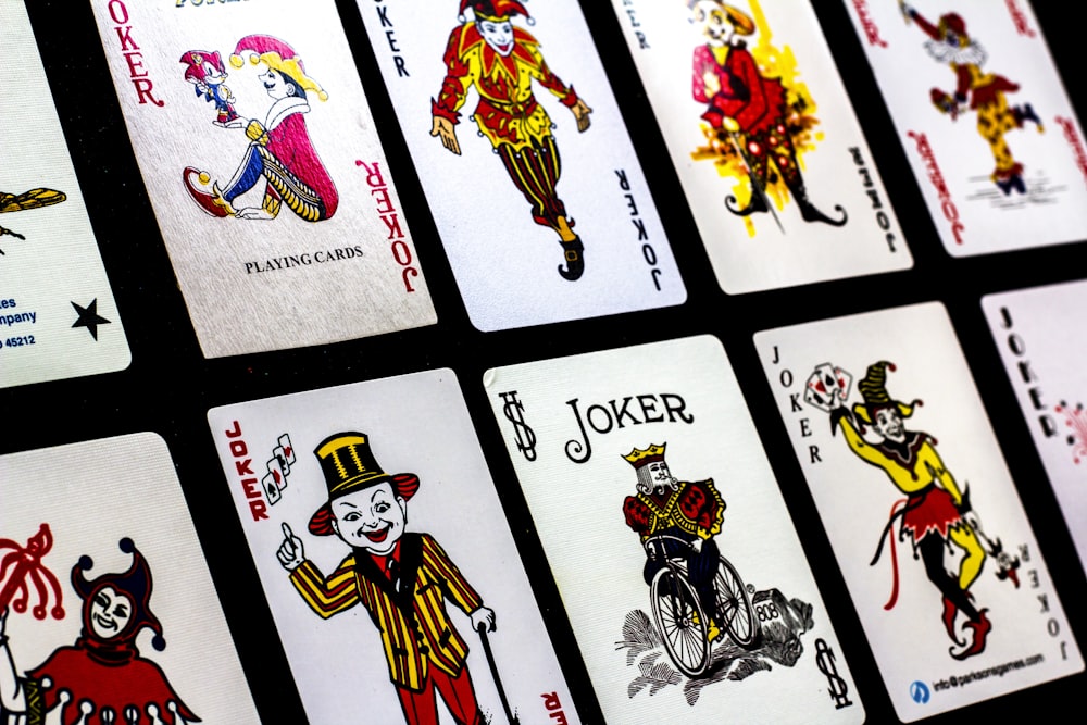 a group of playing cards with clowns on them