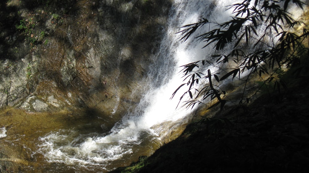 a waterfall with water coming out of it