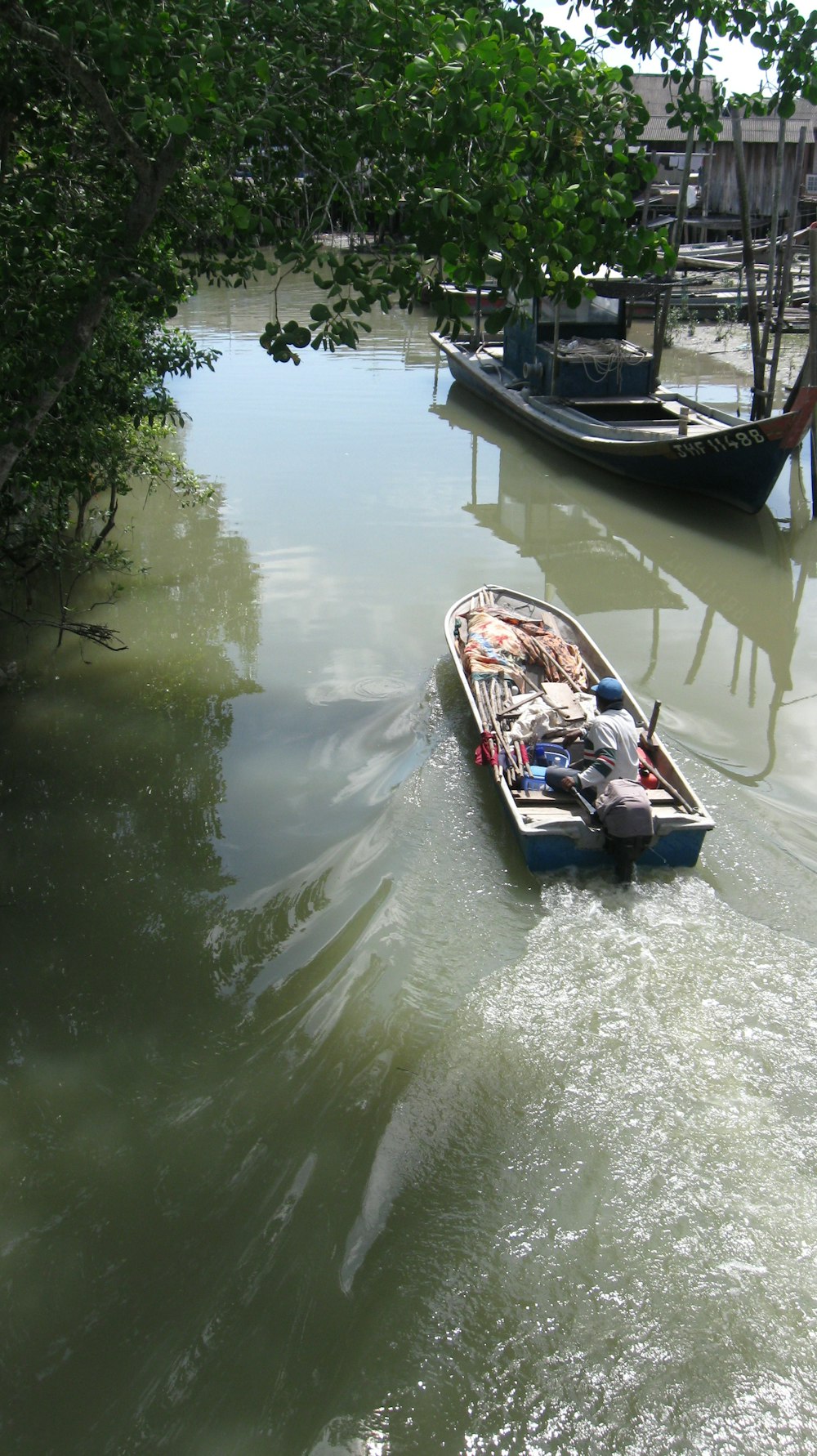 a small boat floating on top of a river