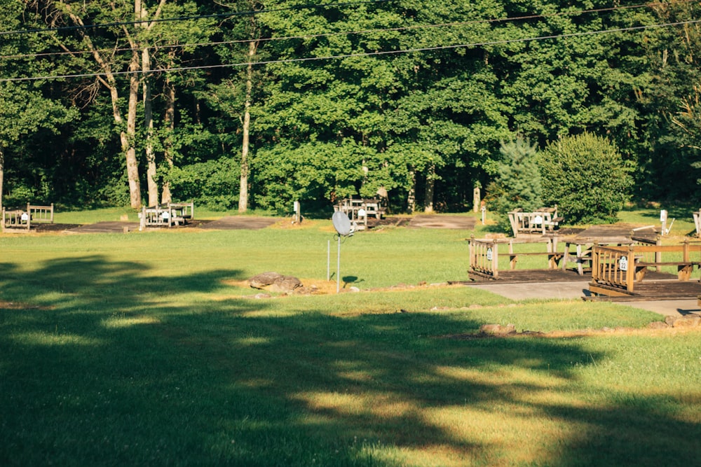 a group of picnic tables sitting in the middle of a park