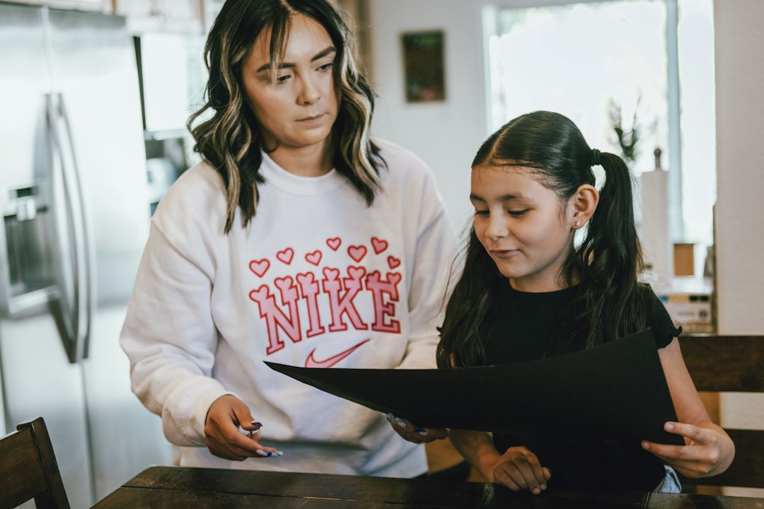 Parent and student studying together at home