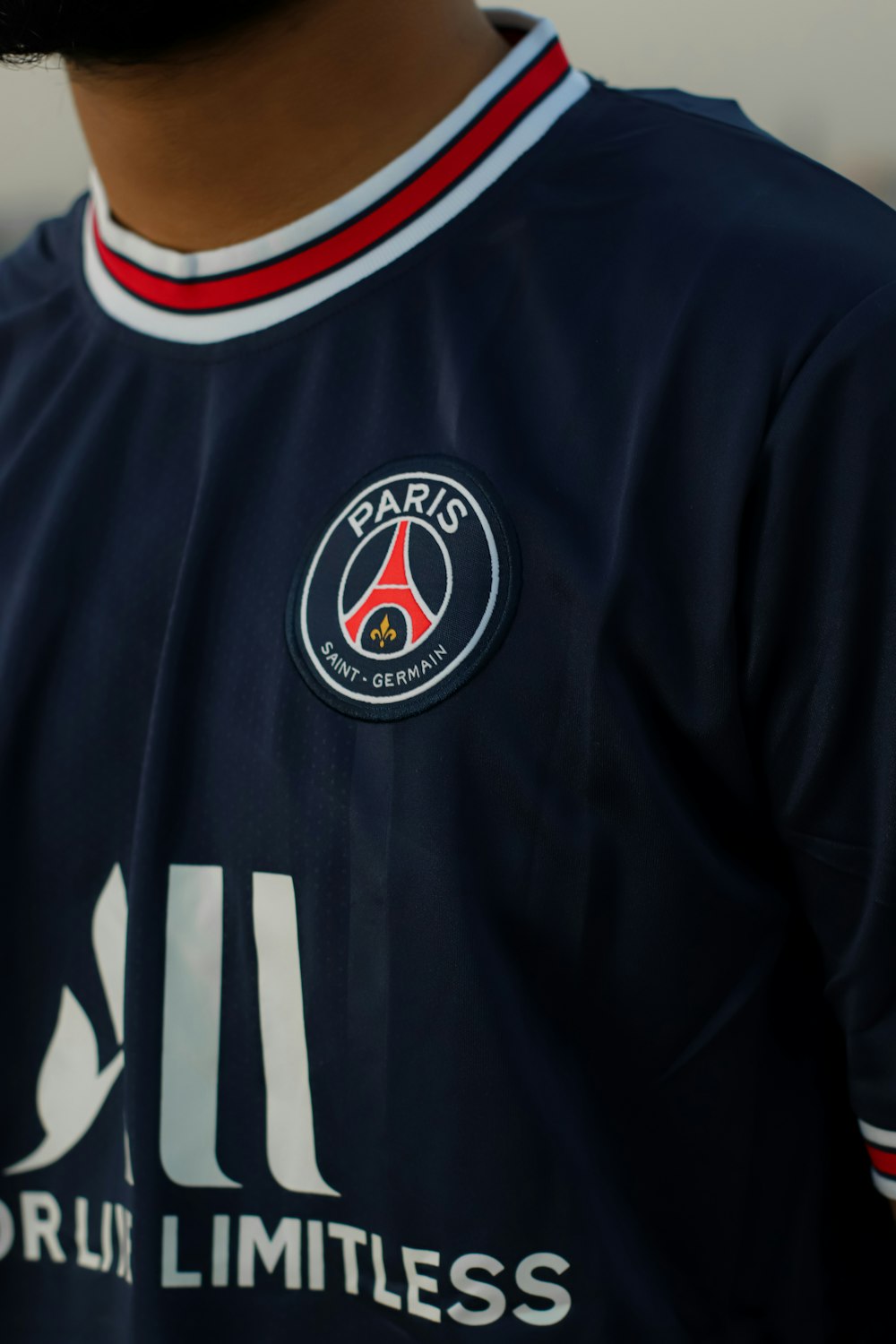a close up of a person wearing a soccer uniform