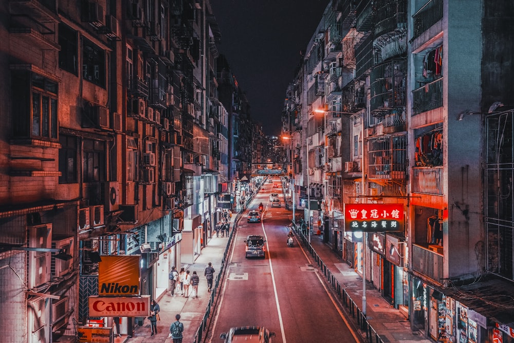 a city street filled with lots of tall buildings