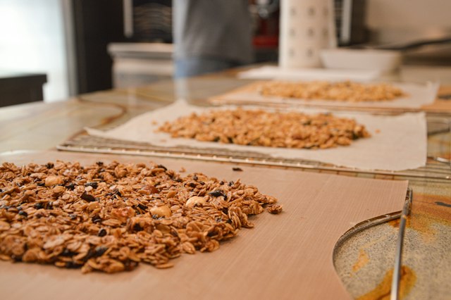 Golden granola clusters cooling on a tray