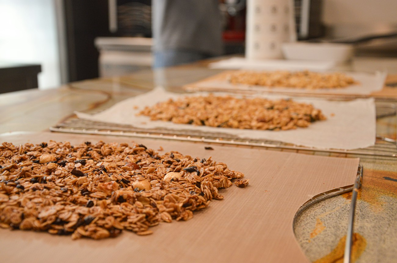 Golden granola clusters cooling on a tray