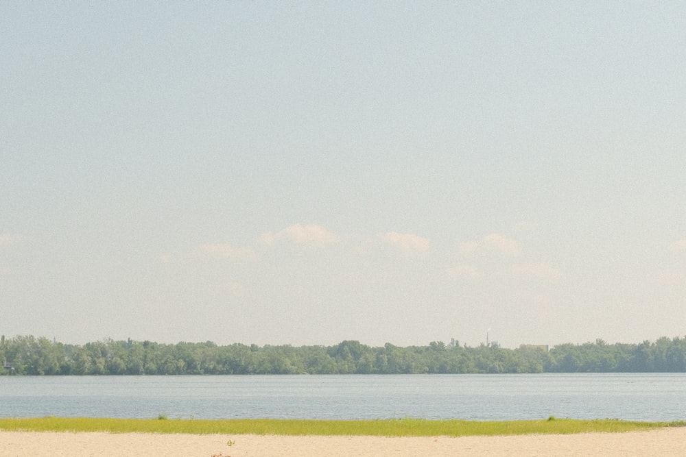 a man is flying a kite on the beach