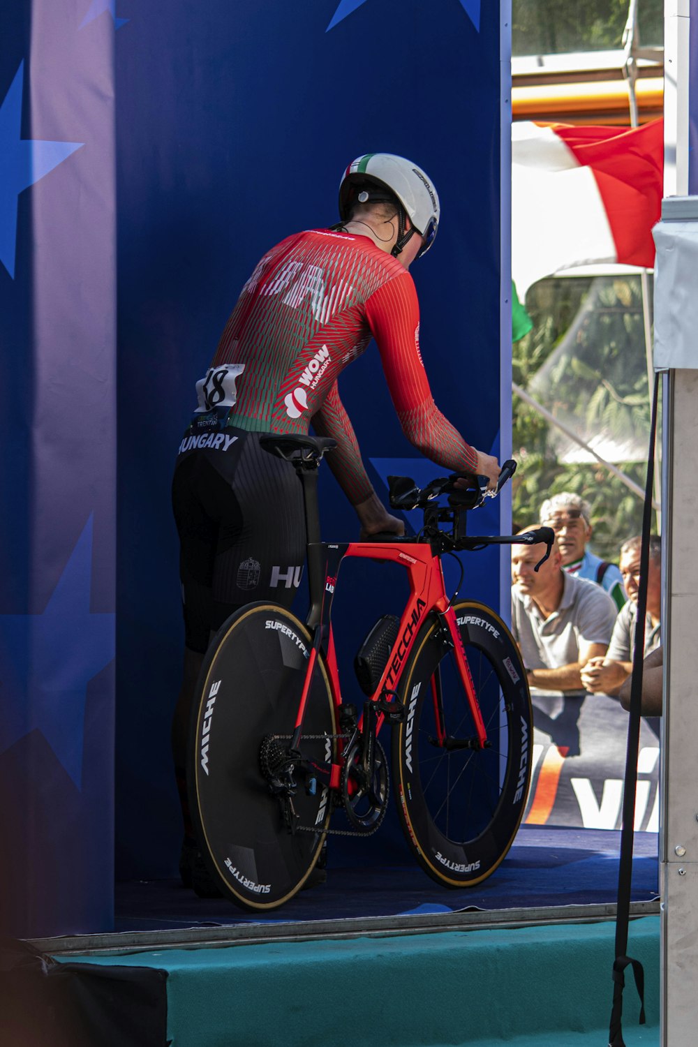 a man riding a bike on top of a stage