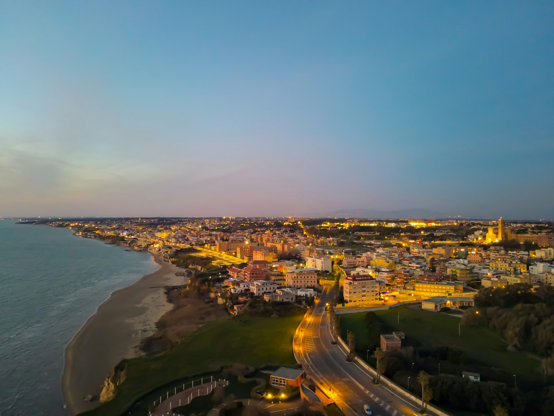an aerial view of a city by the ocean