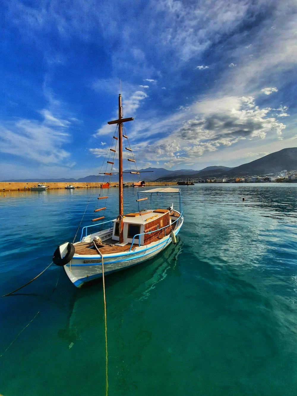 a boat floating on top of a body of water