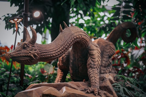 An intricate 3D model of a fantasy creature in a lush environment.