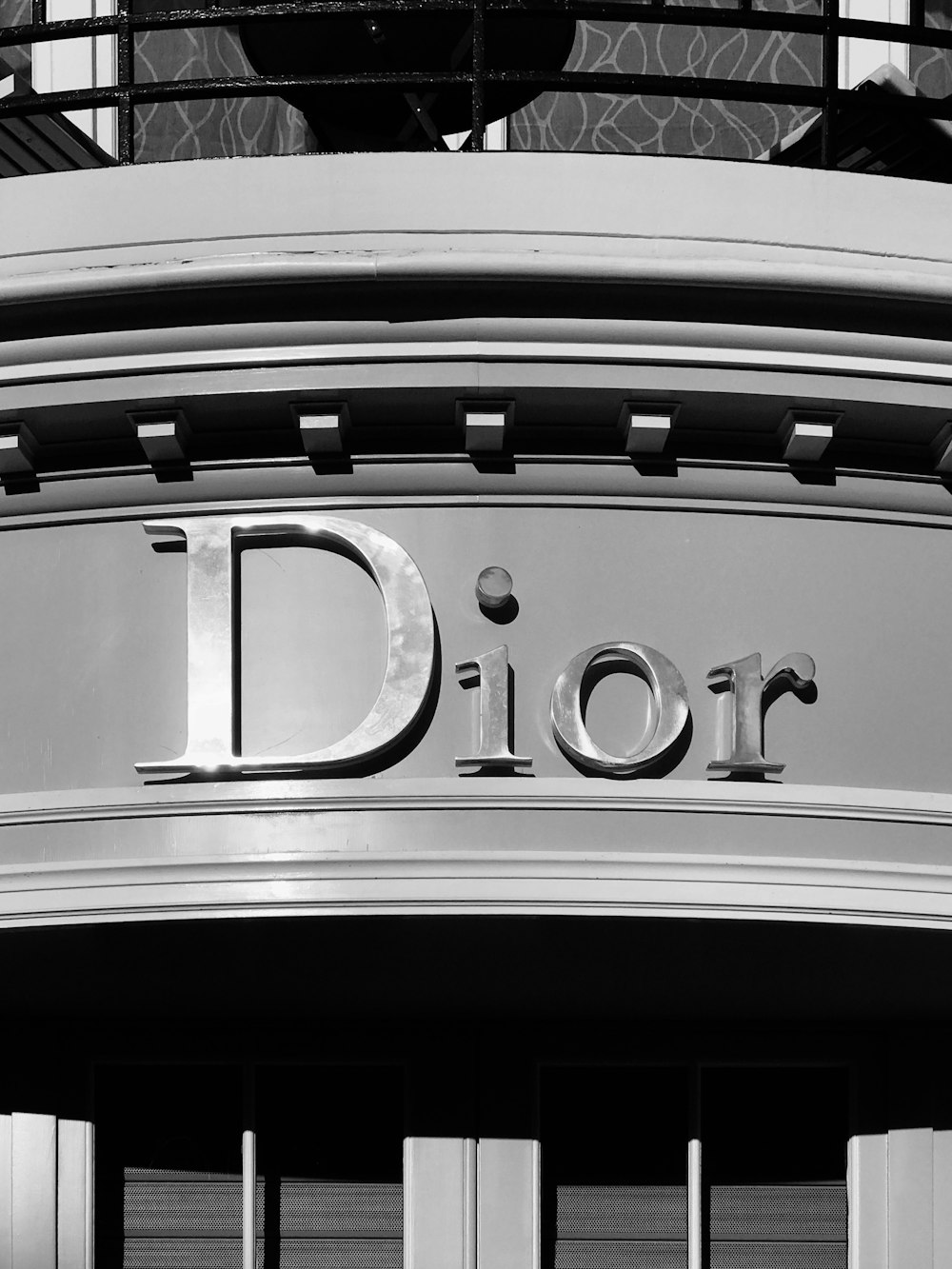 a black and white photo of a dior store