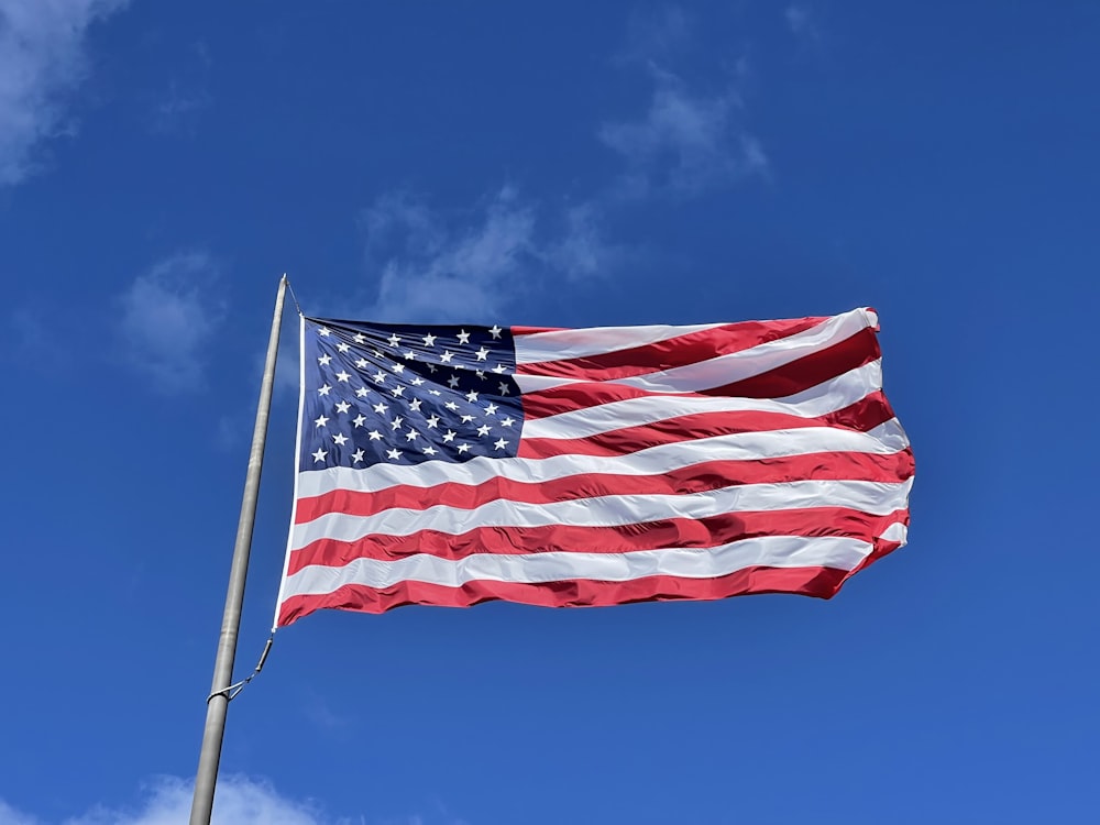 an american flag waving in the wind
