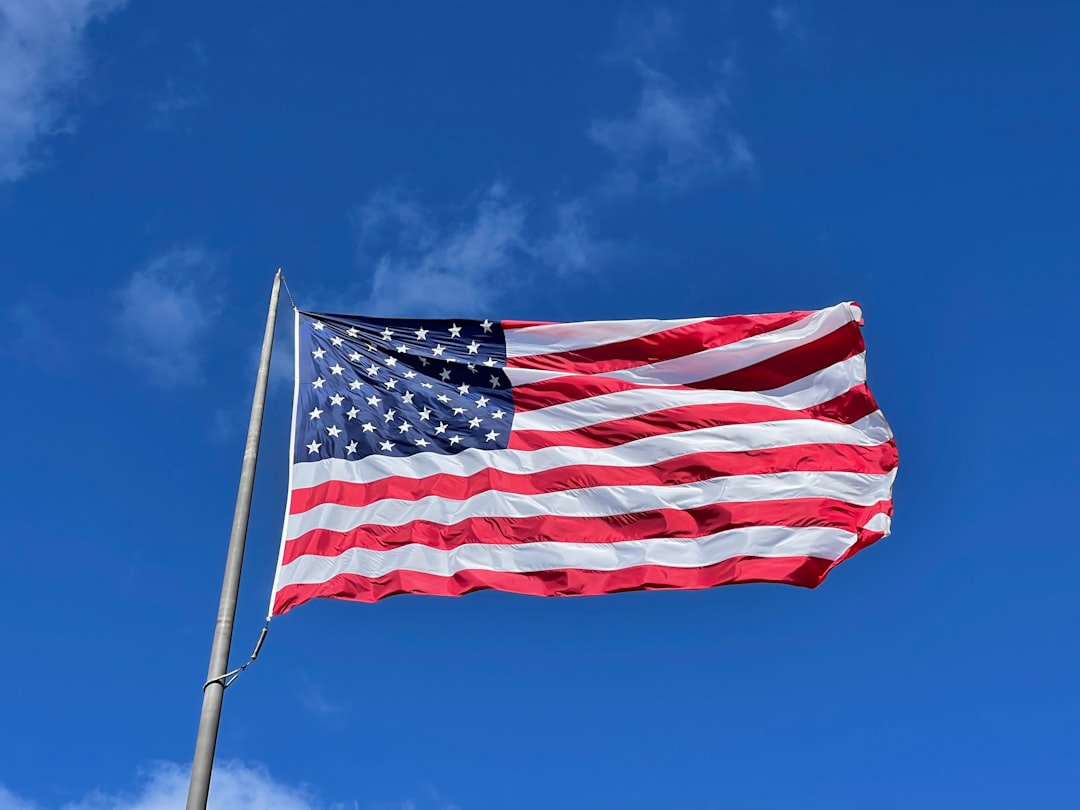 an american flag waving in the wind