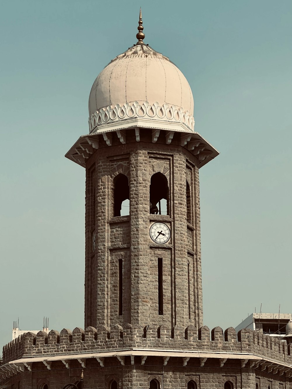 a large tower with a clock on the top of it