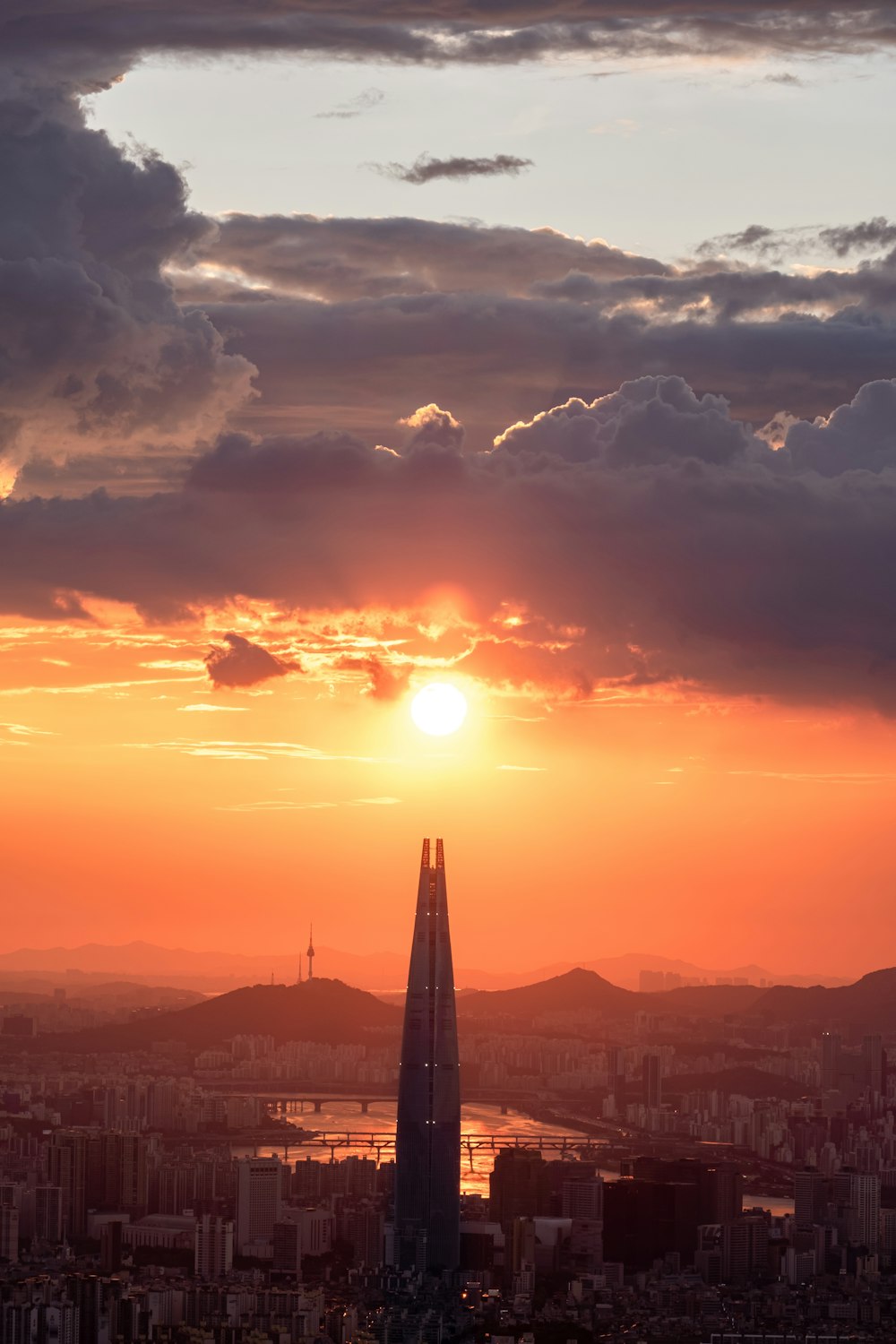 a view of a city at sunset