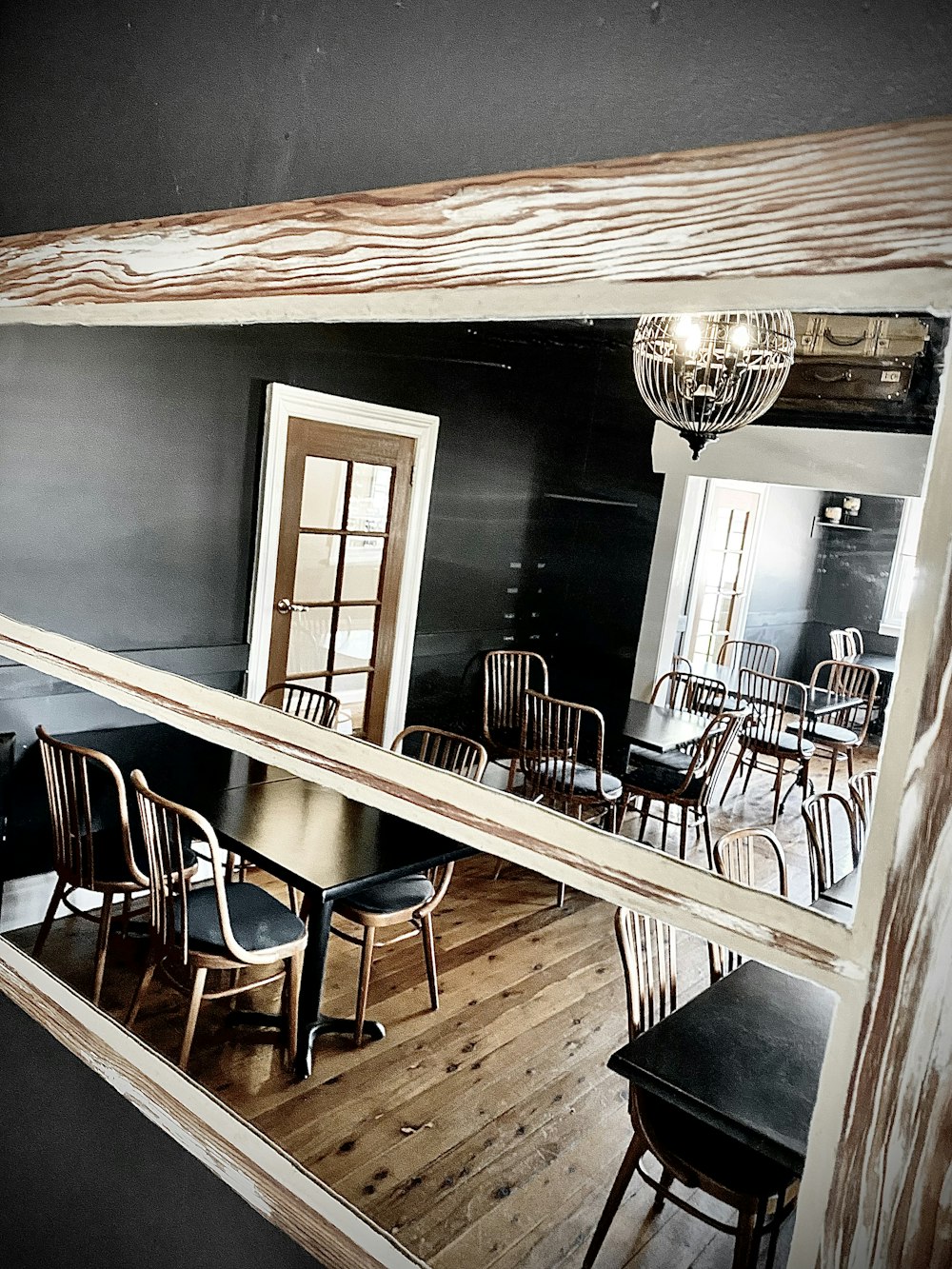 a dining room with chairs and a chandelier