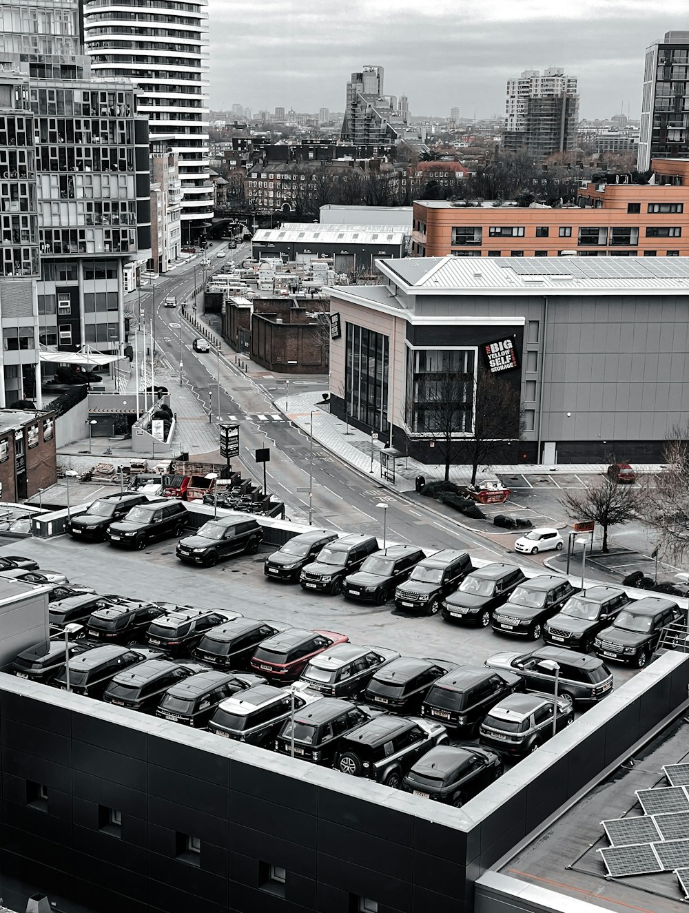 a parking lot filled with lots of parked cars