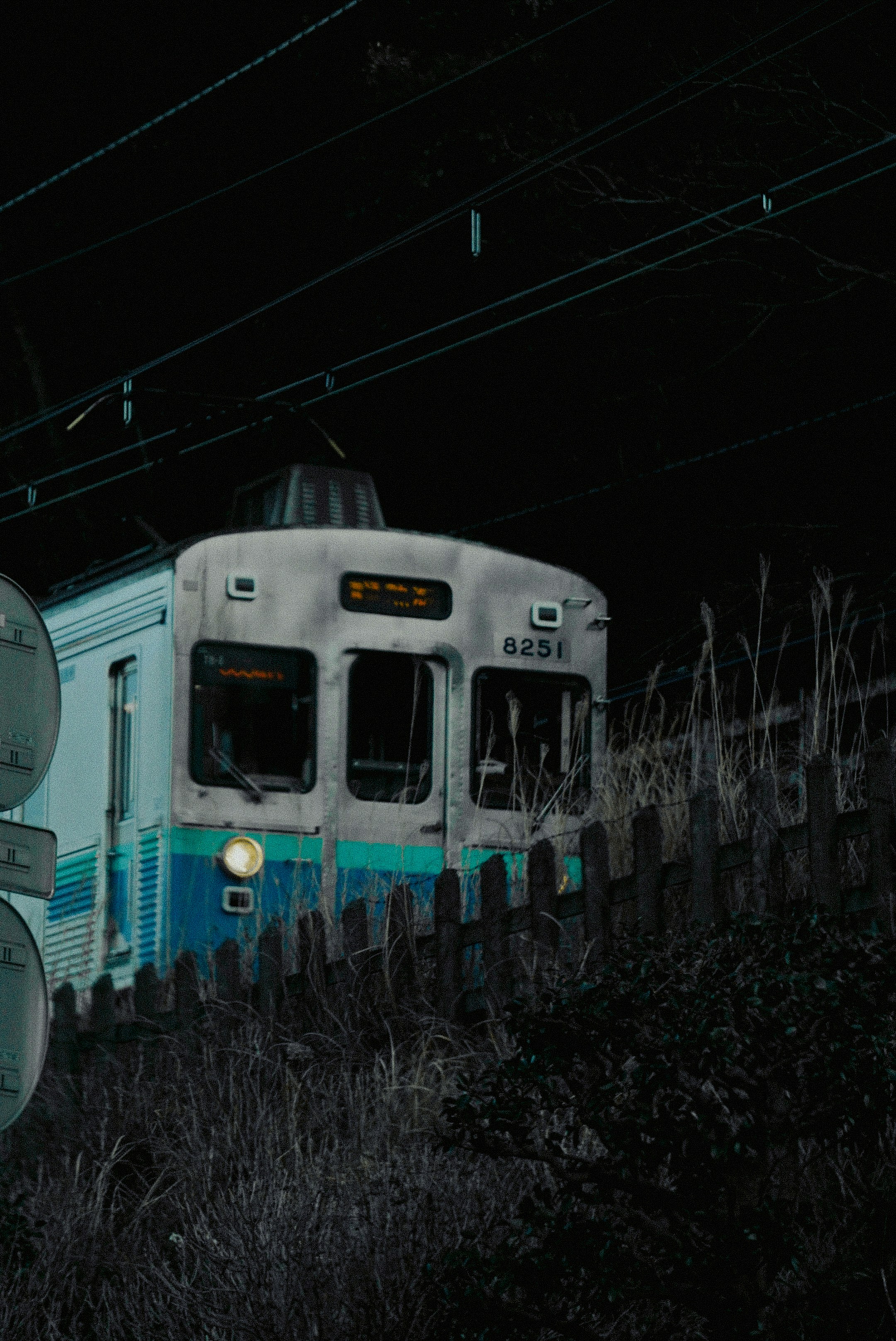 a train traveling through a train station at night