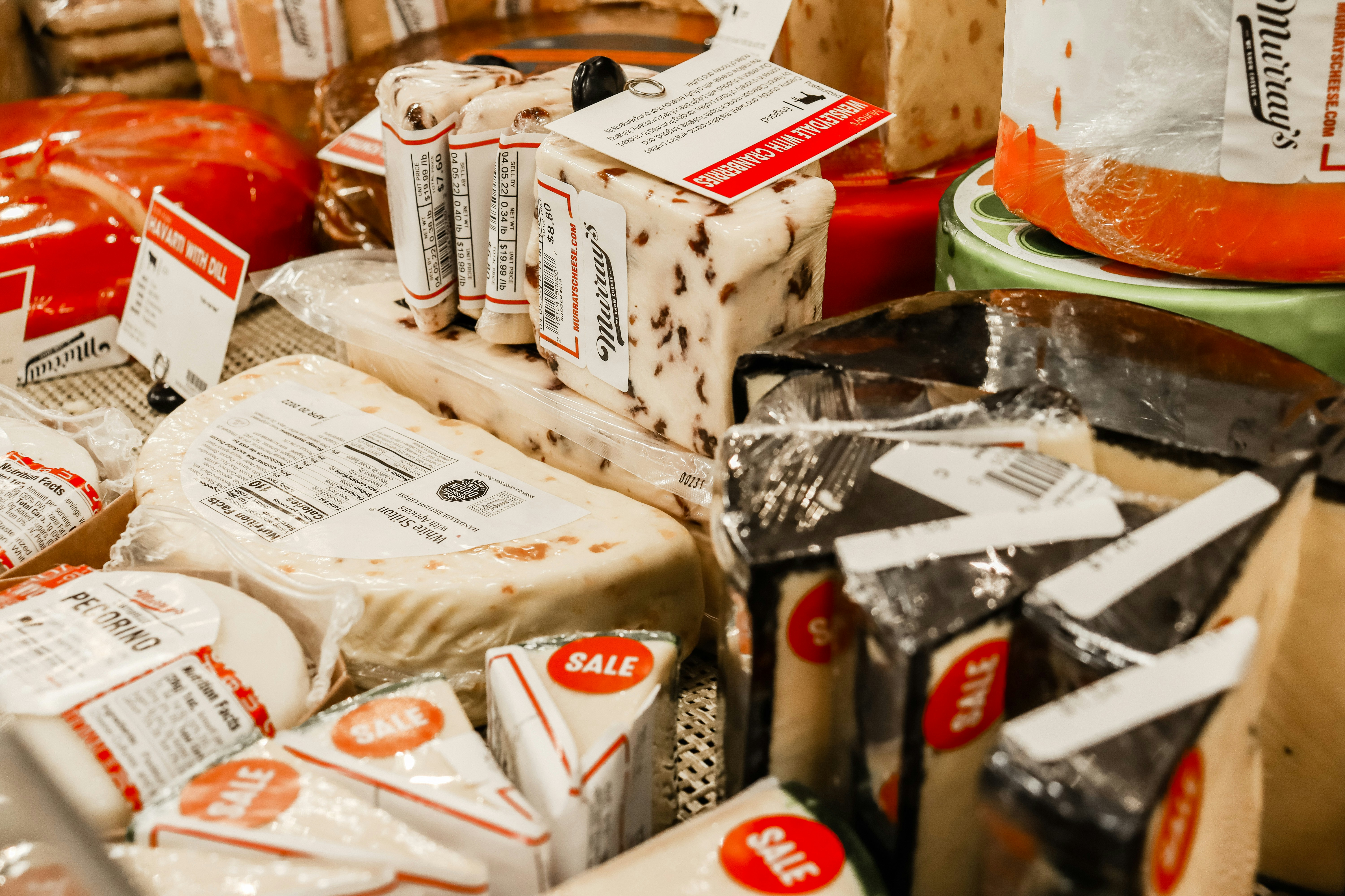 a table topped with lots of different types of cheese