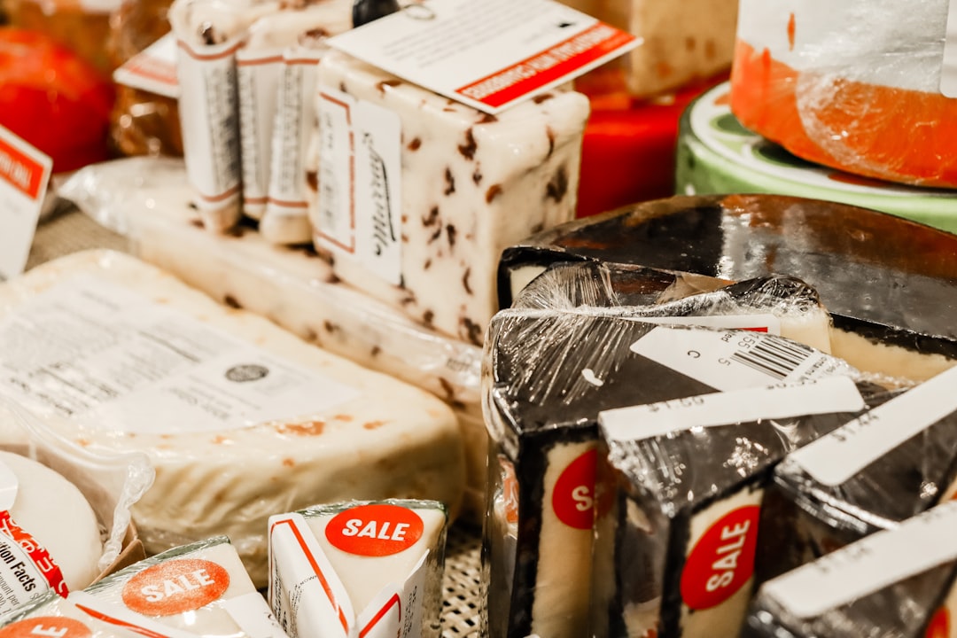 a table topped with lots of different types of cheese, Gourmet cheese