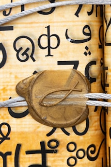 An ancient scroll with celestial symbols glowing softly under moonlight.