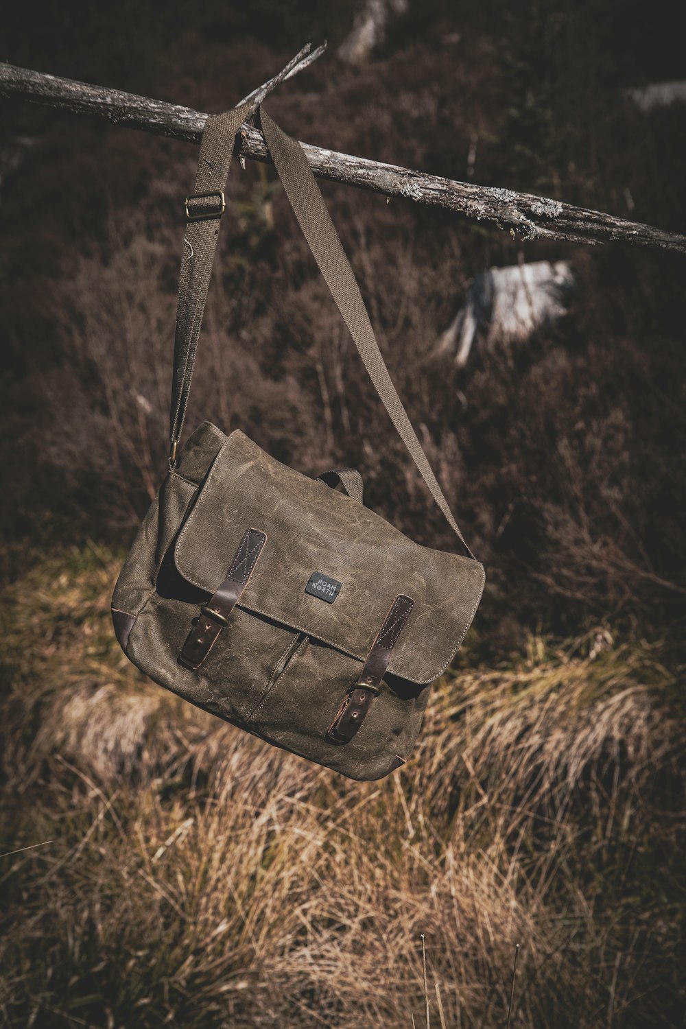 a brown bag hanging from a clothes line