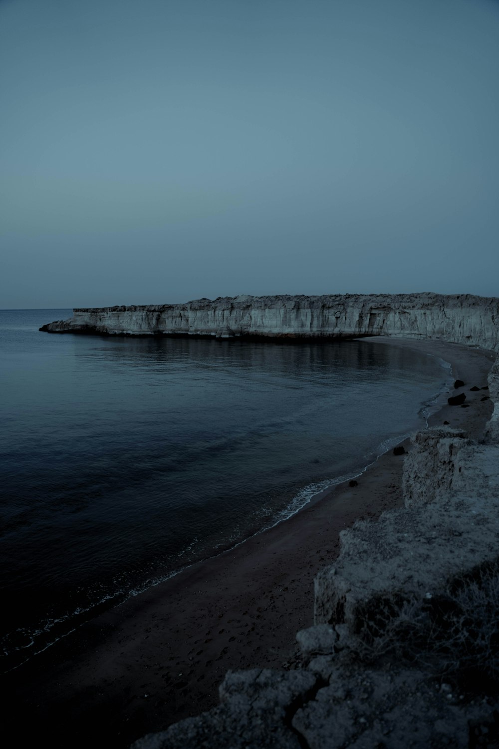 a long exposure photo of the ocean at night