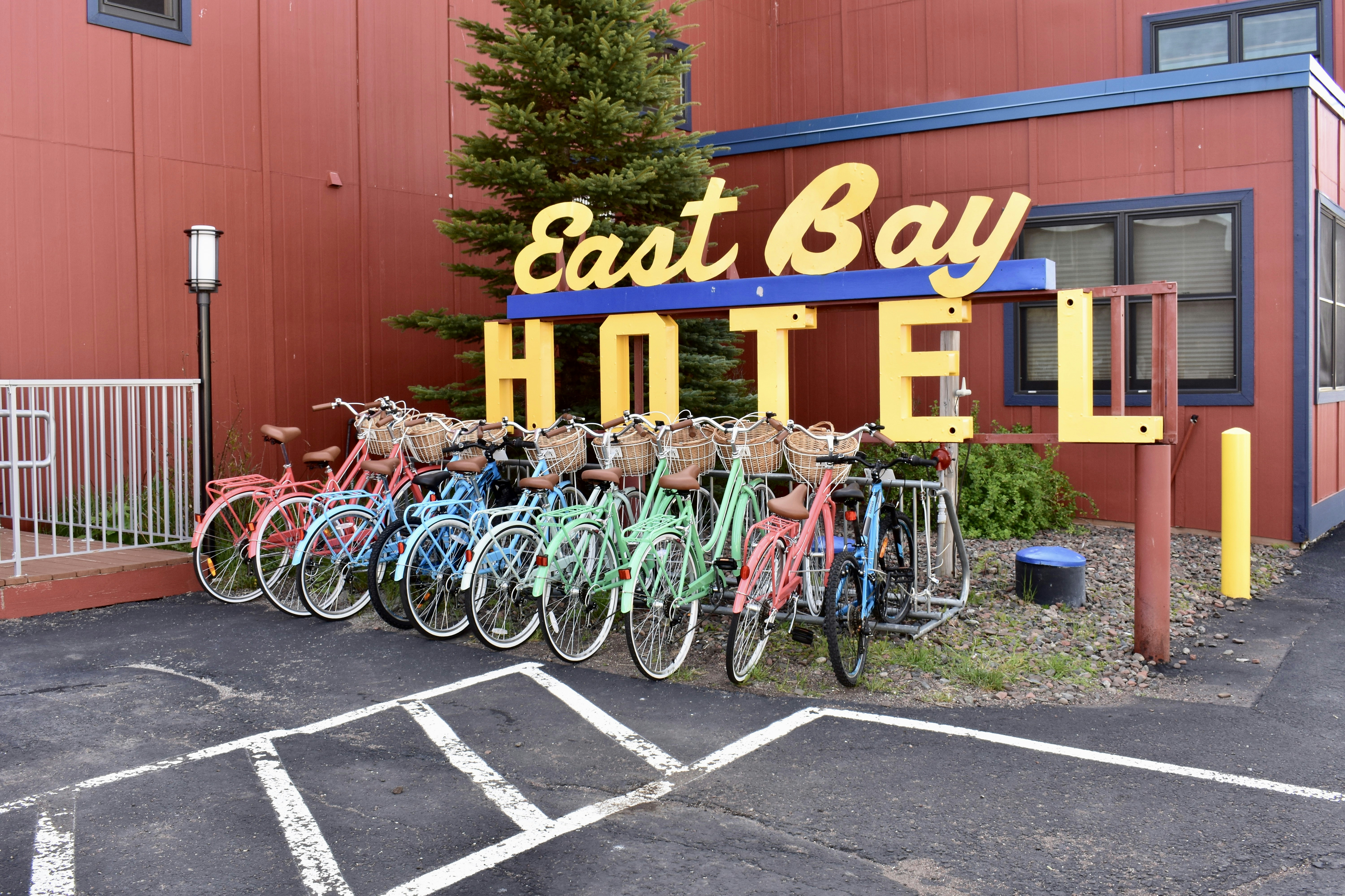 a group of bicycles parked in front of a hotel