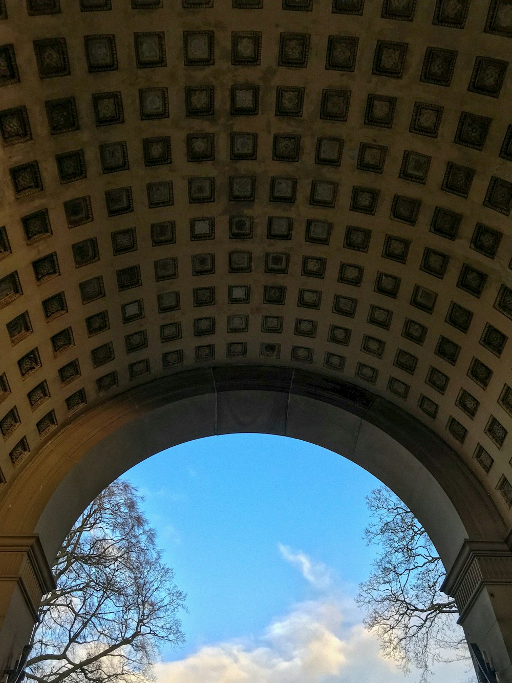 a view of the sky through an arch in a building