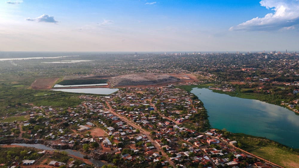 an aerial view of a city and a lake