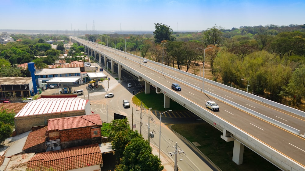 an overhead view of a highway with cars driving on it