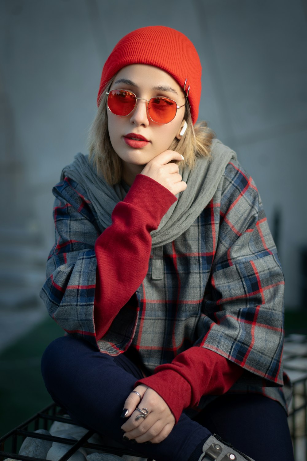 a woman wearing a red hat and sunglasses