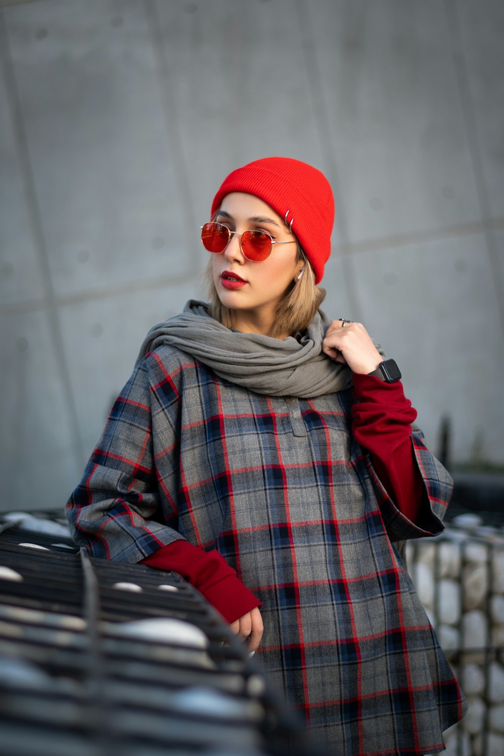 a woman wearing a red hat and scarf