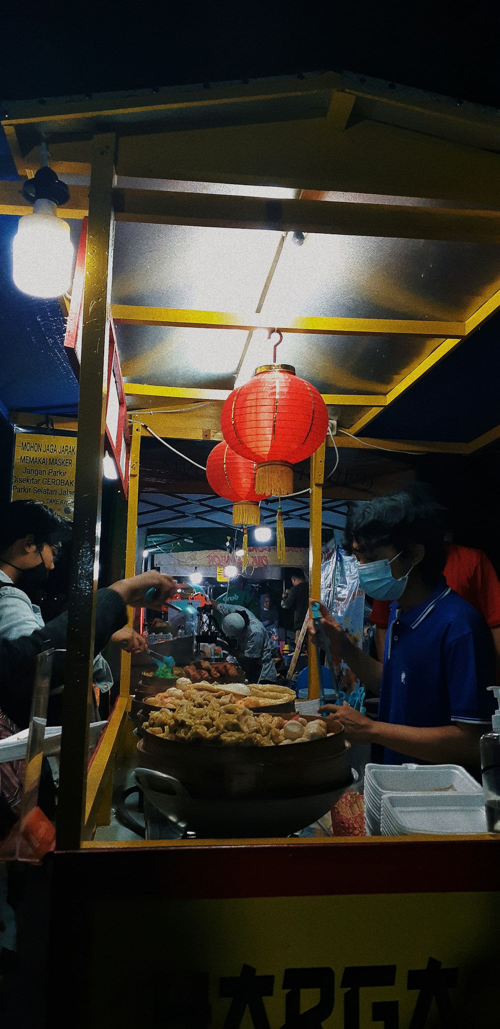 a food stand with a large pie on top of it