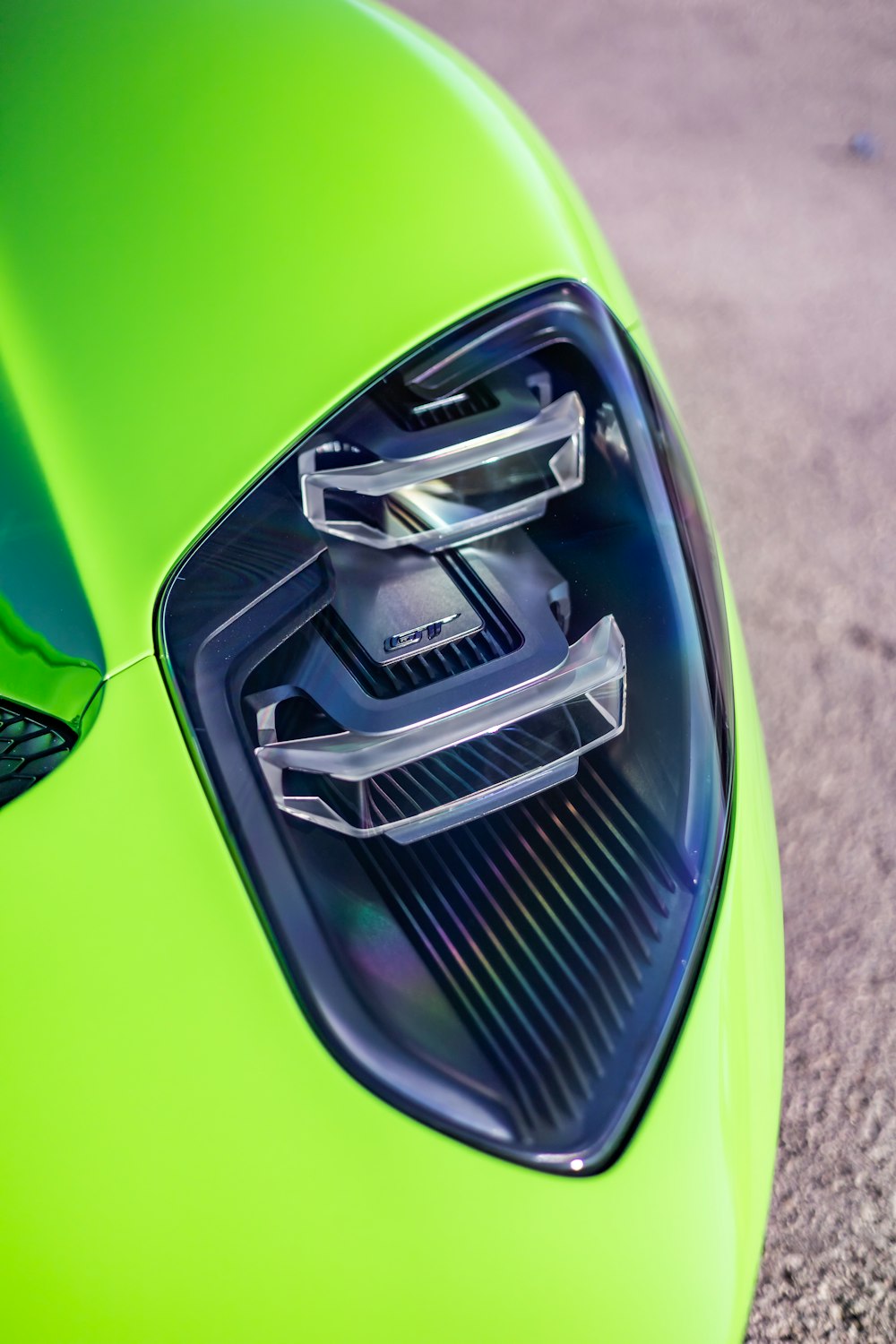 a close up of a green sports car