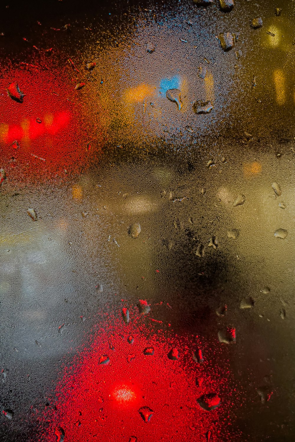 a close up of a window with rain drops