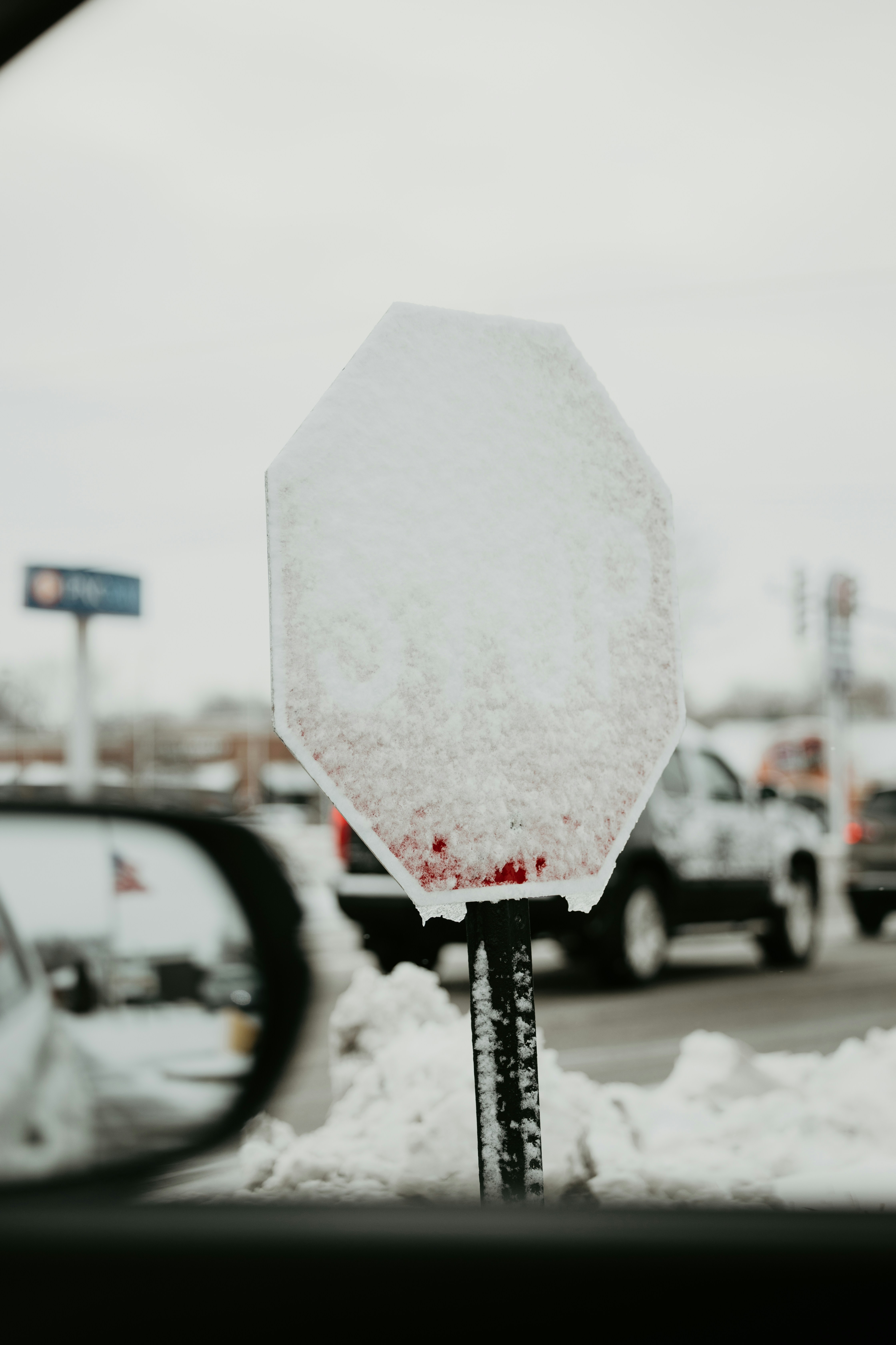 a stop sign that is covered in snow