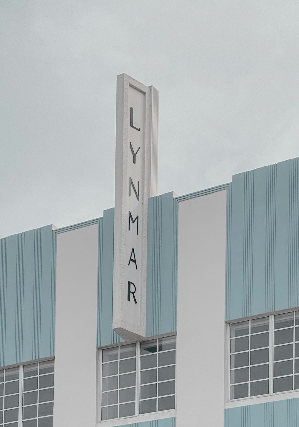 a tall building with a sign on the side of it