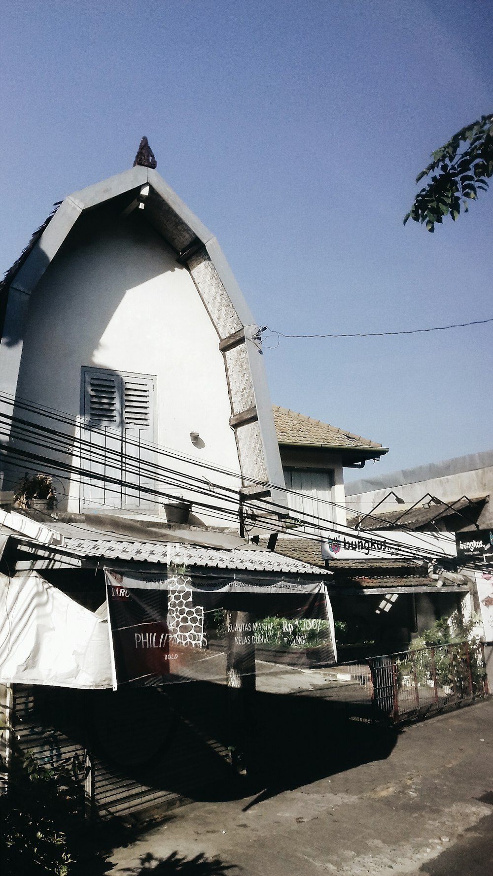 a large white building sitting next to a street