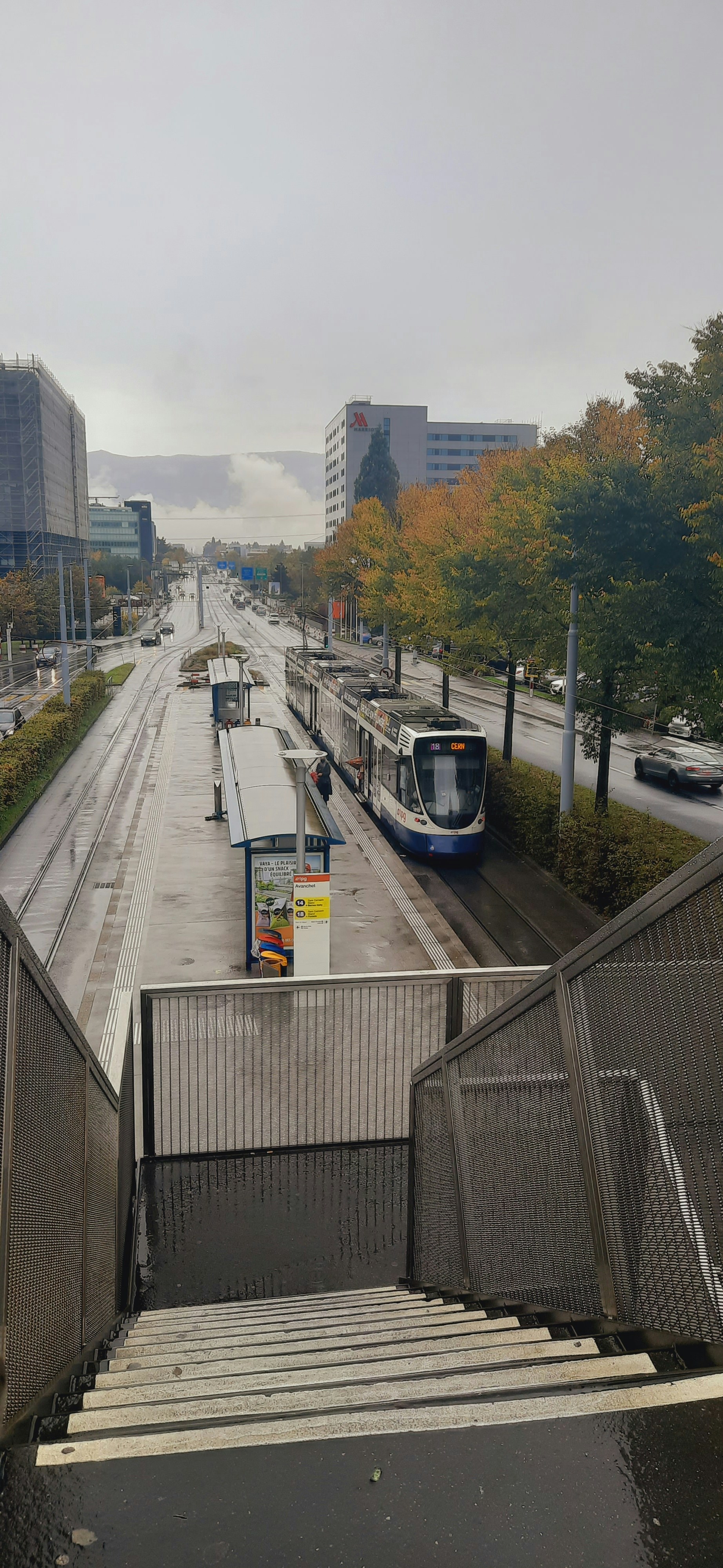 A train is coming down the tracks in the city