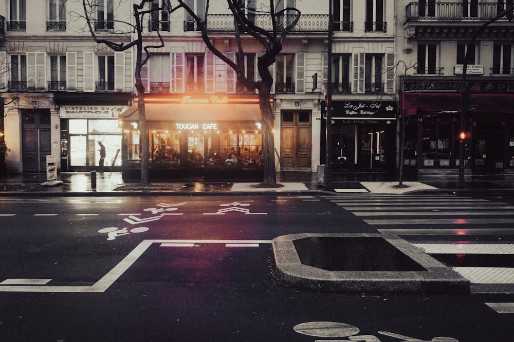 a city street with a crosswalk in the middle of it