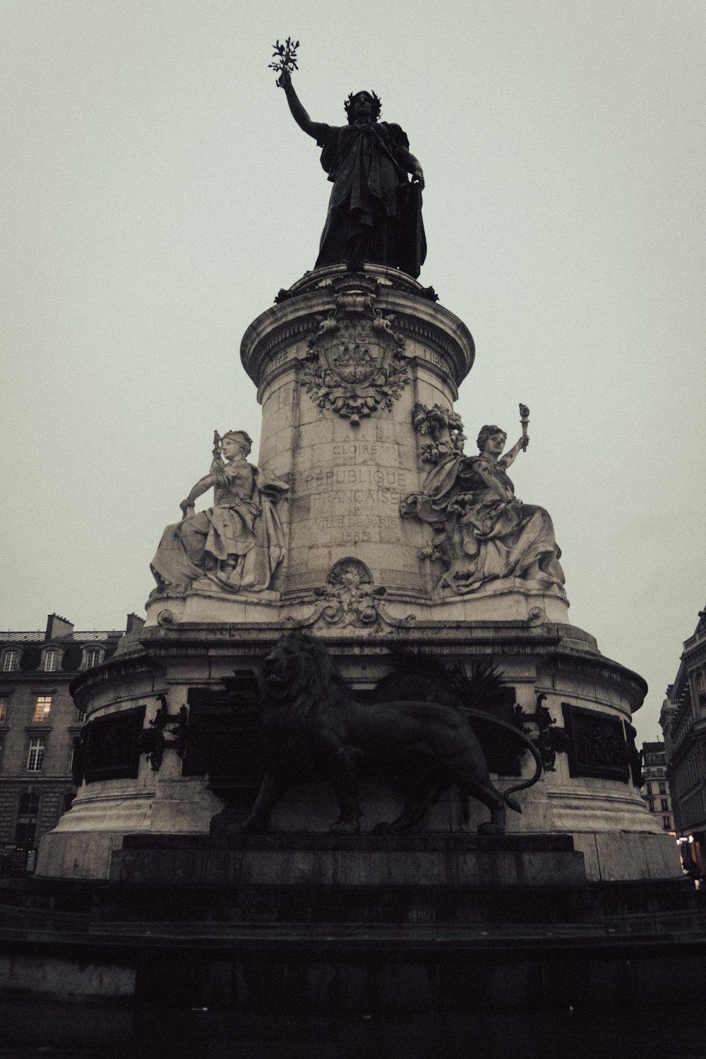 a statue of a man on top of a building